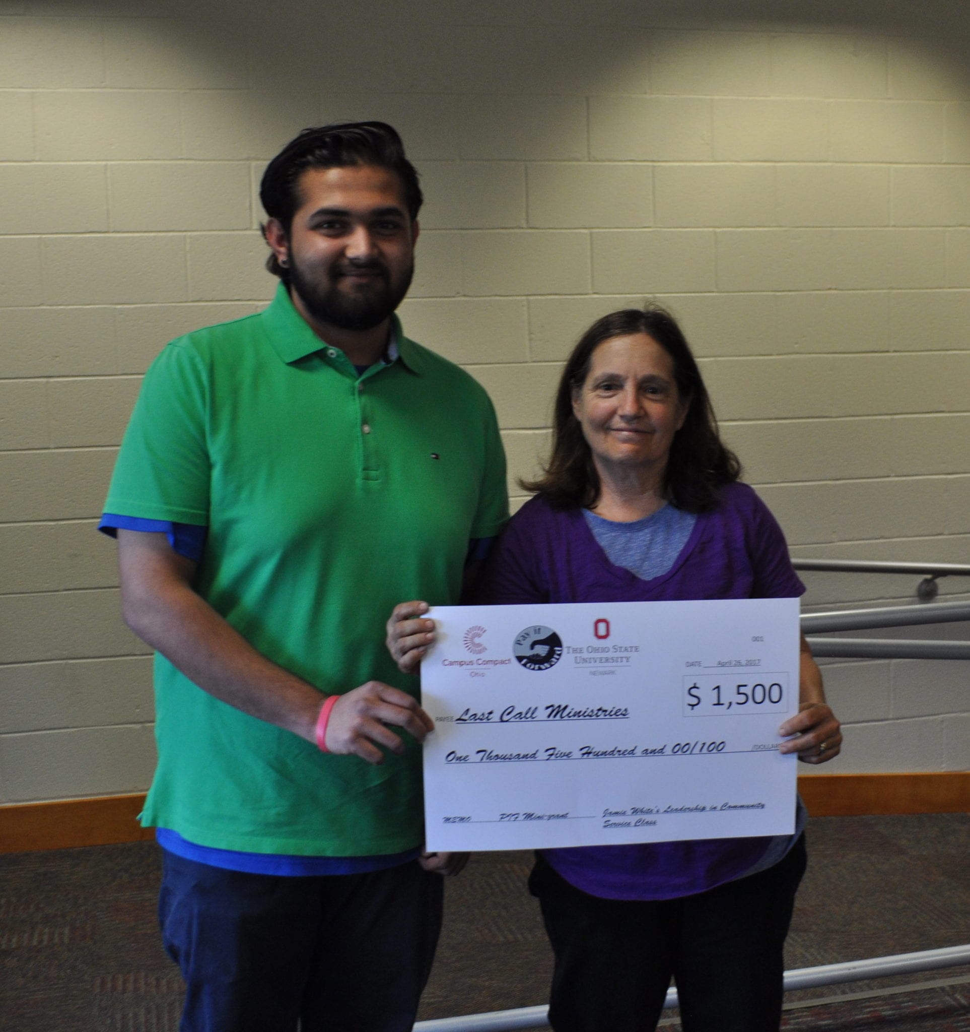 PIF student presents a grant check